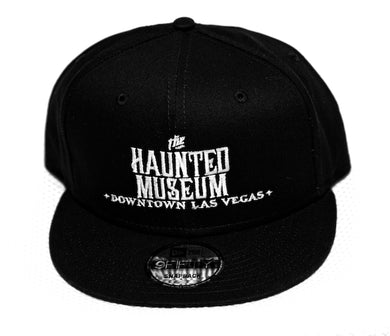 Snapback cap embroidered with the Haunted Museum logo. 